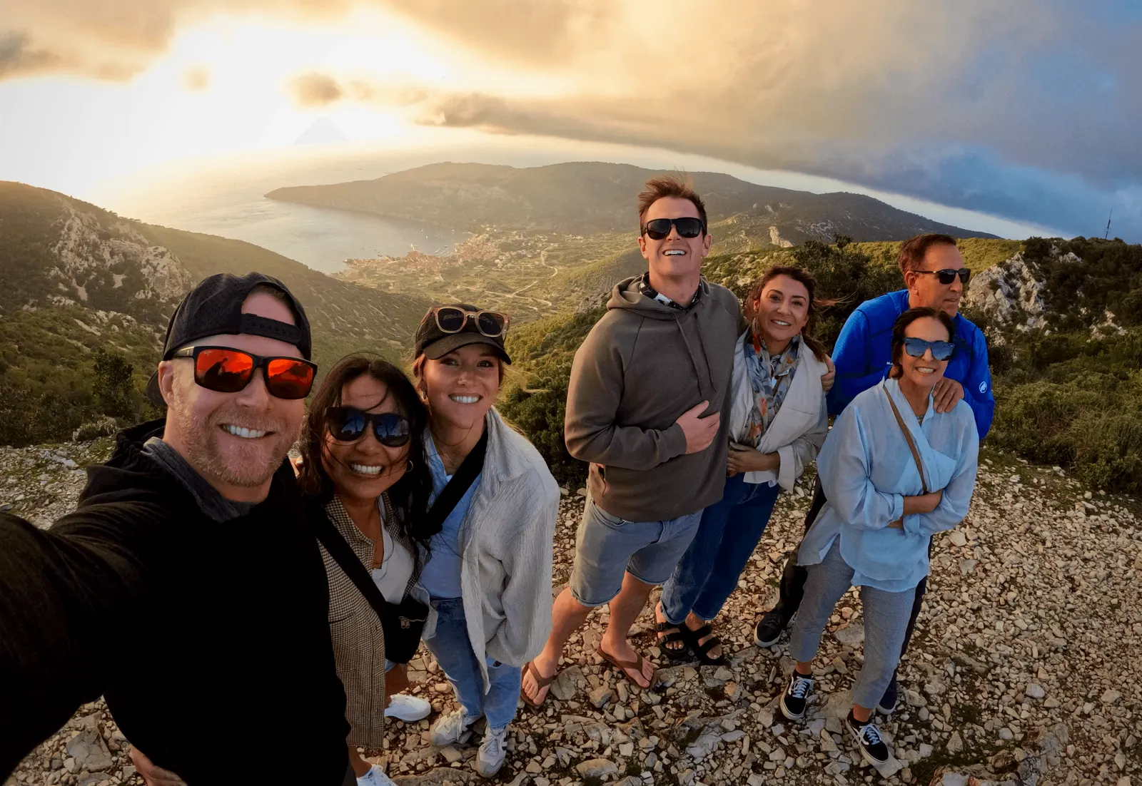 The founding team on a hillside overlook above the coast